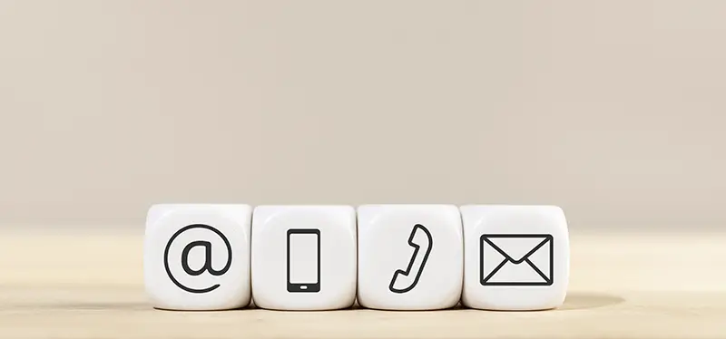 Contact us icons on white cube blocks