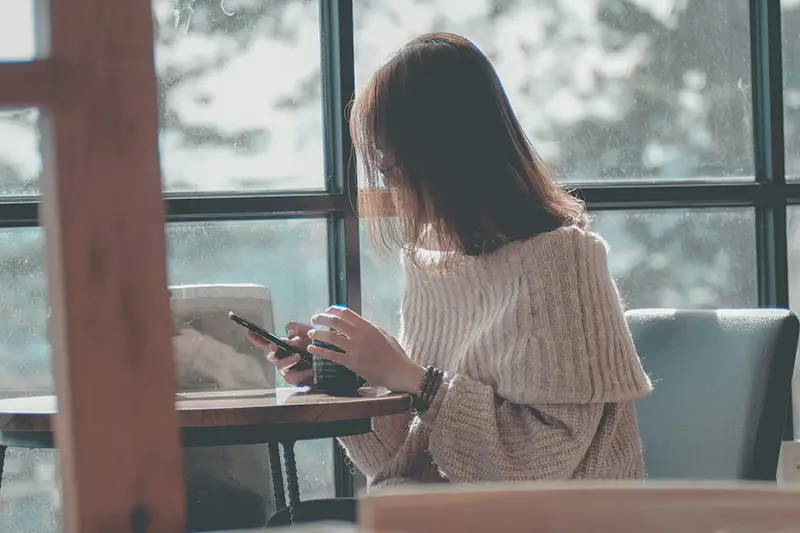 Woman using her phone for messaging