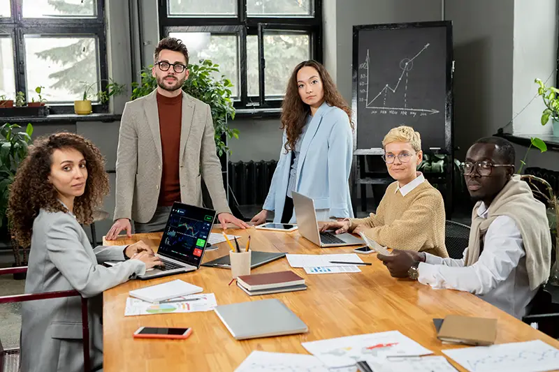 Digital marketing team inside boardroom meeting