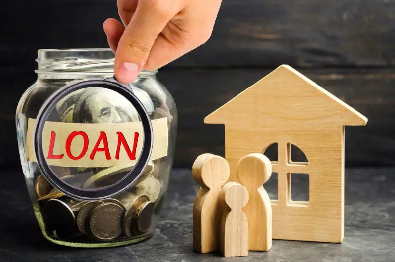Model of the house, money and the inscription "Loan"
