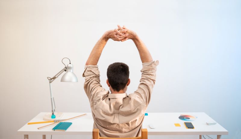 Man Working from Home on Desktop Computer. Creative Designer relaxed in his work set.