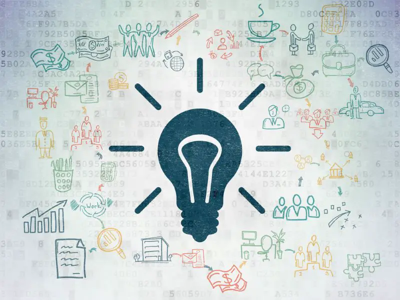 Finance concept: Light Bulb on Digital Paper background