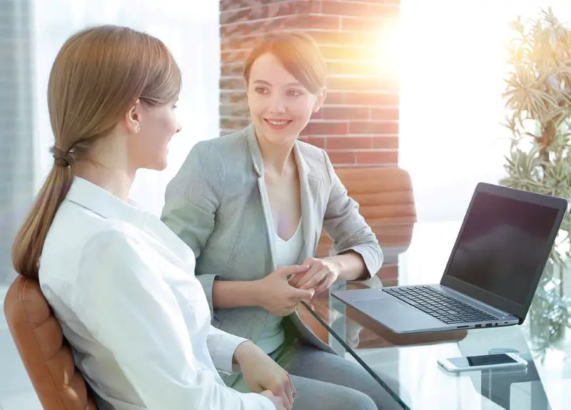 Business coach and female client having a meeting in the office