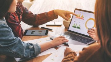 Three businessman working and discussing business together in a meeting