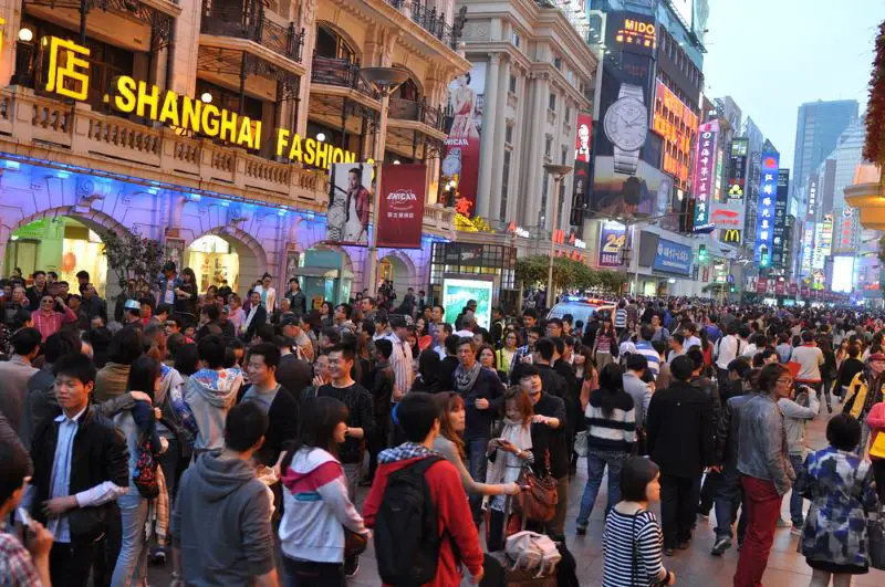 Tourists crowd the Nanjing Road shopping street in Shanghai China