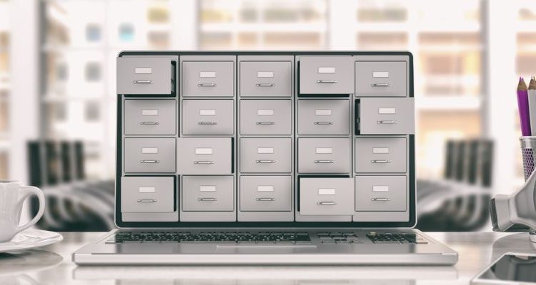 Laptop displaying an electronic filing cabinet to represent a digital document filing system.