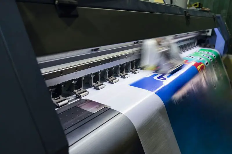 Large format inkjet printer machine working on vinyl paper