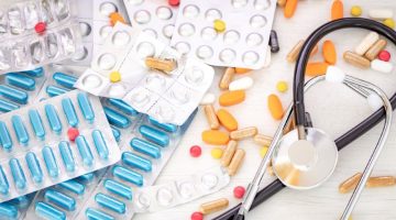 A large amount of medicine with a stethoscope on the doctor's desk