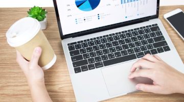 Side view picture of businessman analyzing financial graphs