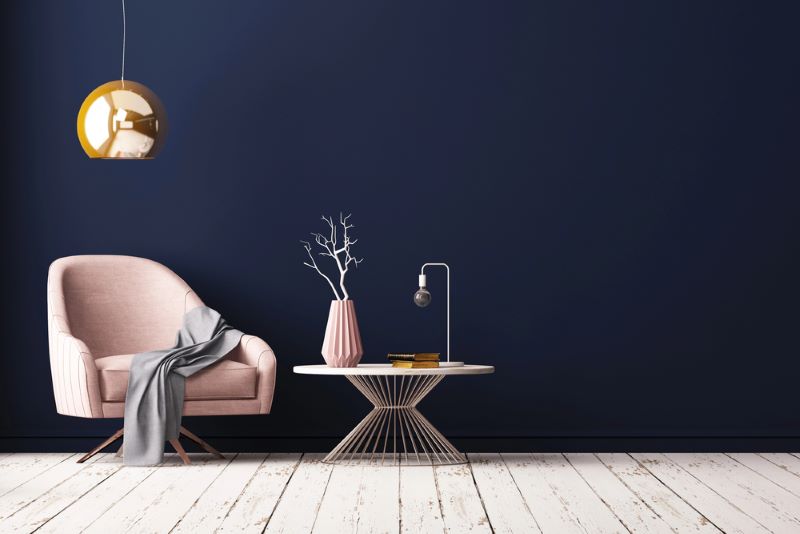 Modern room interior with armchair and table