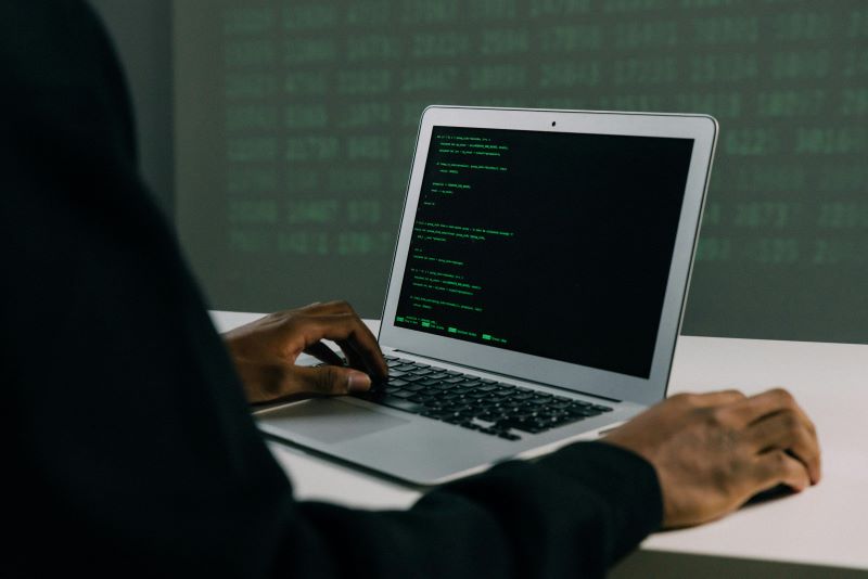 Software developer working on a laptop