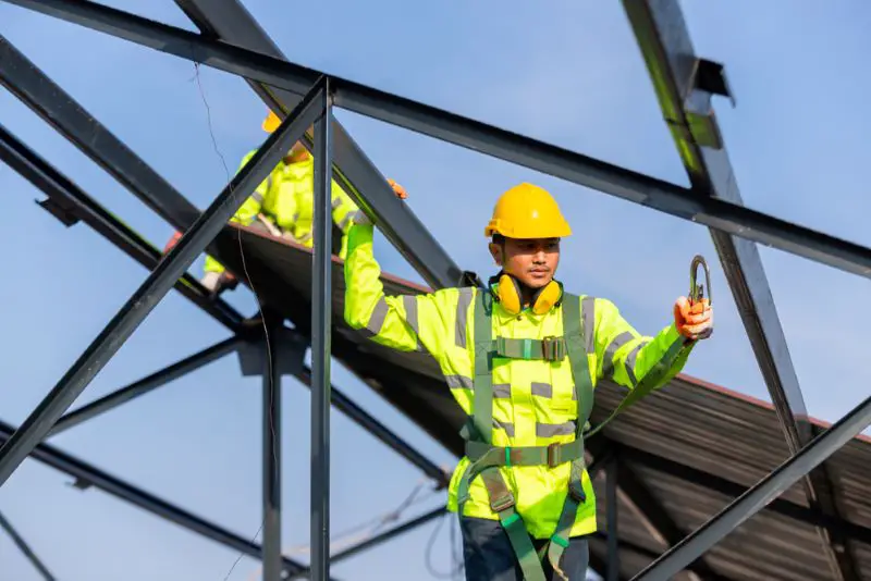 Asian roof construction worker wear safety height equipment