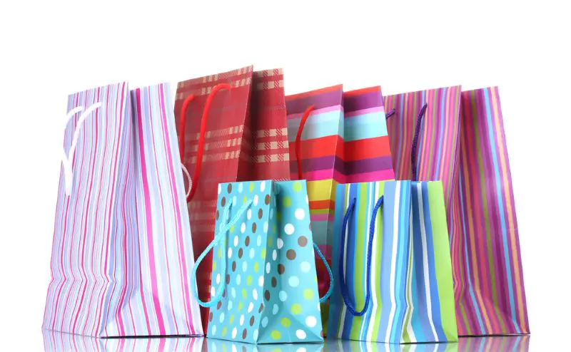 Bright shopping bags isolated on white