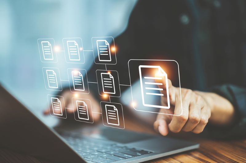 Businessman document management concept with icons on virtual screen