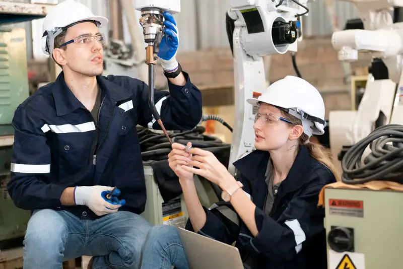 Workers in manufacturing factory, production engineering