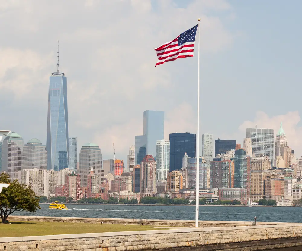 United States Flag and background view of New York