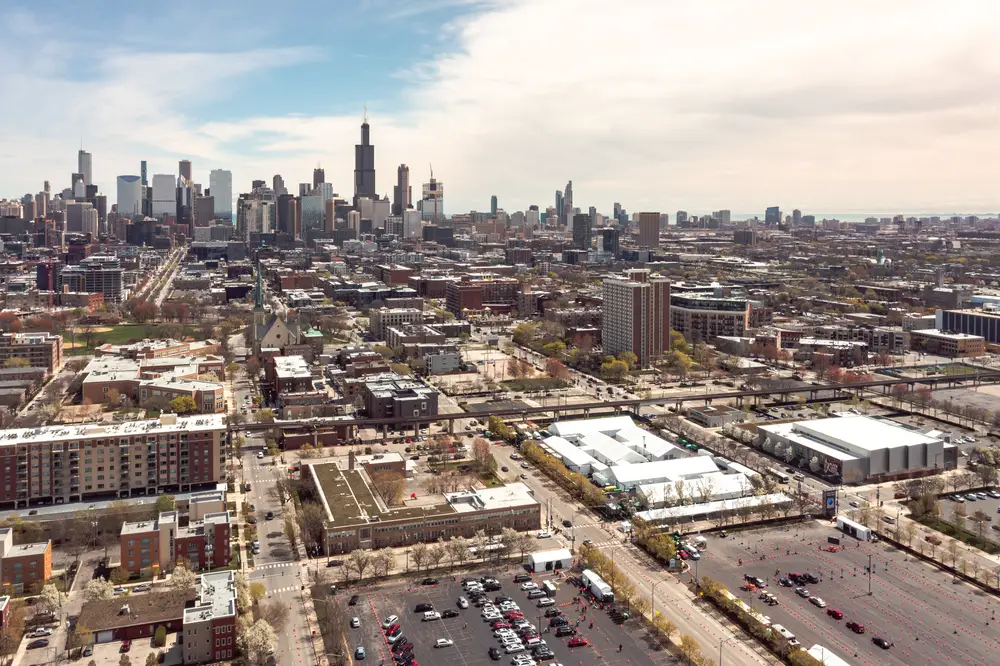 Chicago, IL - April 17th, 2021: White tents and orange cones sit in the parking lots outside of the United Center at the temporary FEMA vaccination center for distributing doses to combat Covid-19.