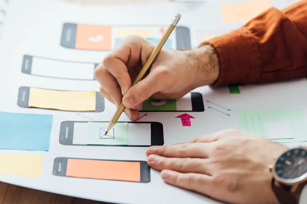 cropped view of app developer working on app layout