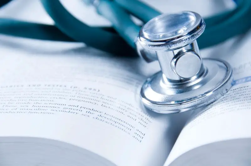 Medical concept – stethoscope placed on medical book