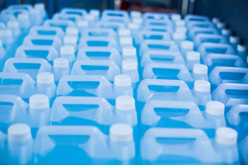 Plastic canisters containing blue liquid