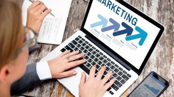 Business people using laptop