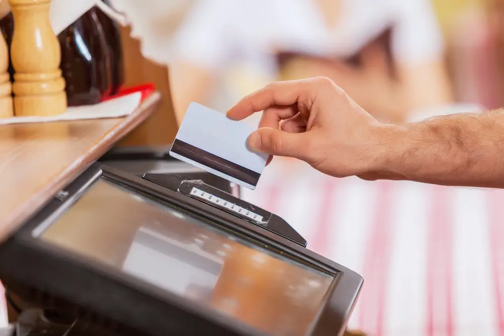 Close-up of cashier hands – at a POS system