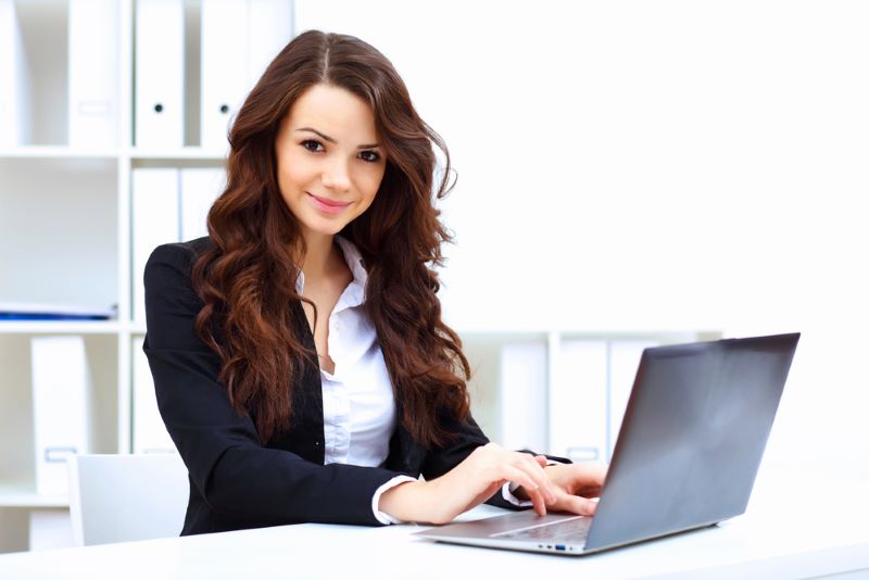 Young business woman with laptop computer