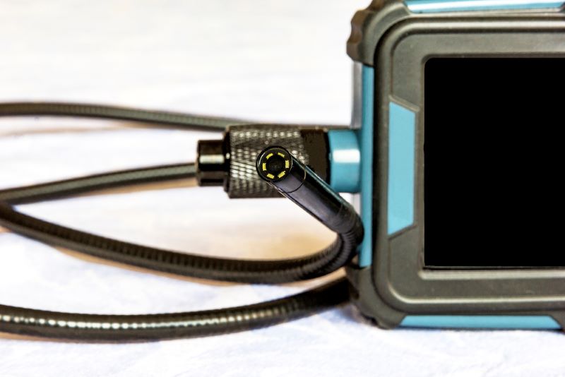 Endoscope camera on the table. Flexible visual inspection camera