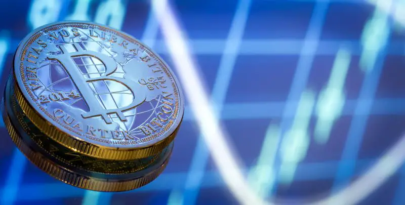 Bitcoin, a new concept of virtual money, graphics and digital background. Gold coin with the image of the letter B. Mining or the blockchain technology, close-up