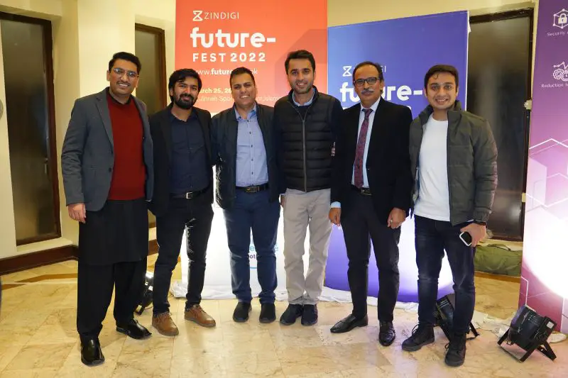 Group photo of Mehroz and Azam and colleagues at Future Fest 2022 Event