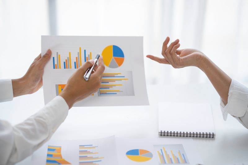 Statisticians analysing data and charts