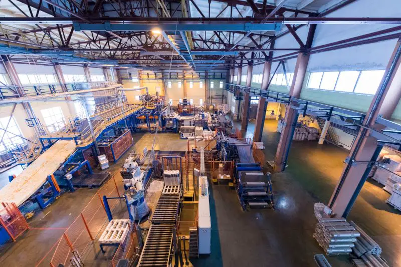 Fiberglass production industry equipment at manufacture background