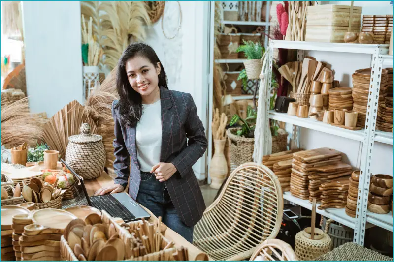 Entrepreneur recognized with local business awards for handmade woodcraft products.