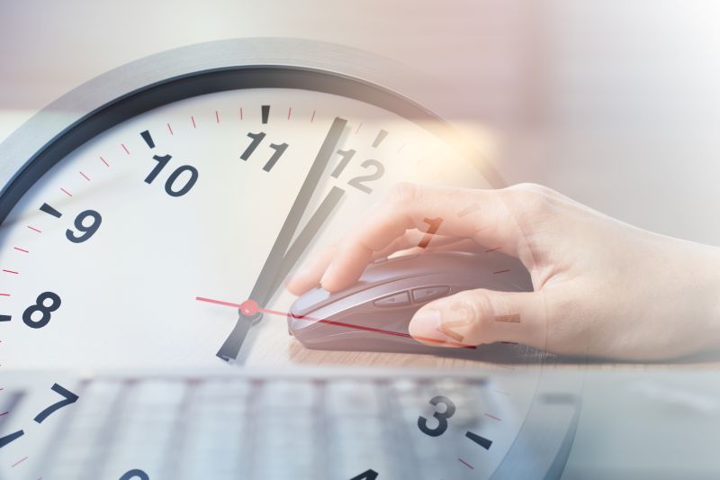 Business Woman Working with Laptop computer overlay with Afternoon Break Lunch Times Clock