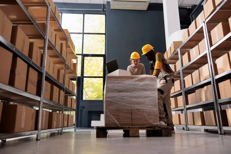 Diverse employees having an inventory in the warehouse