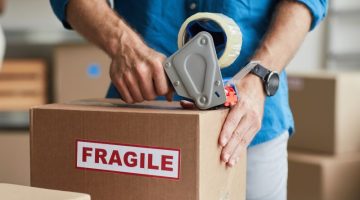 Man Packing Box with fragile label