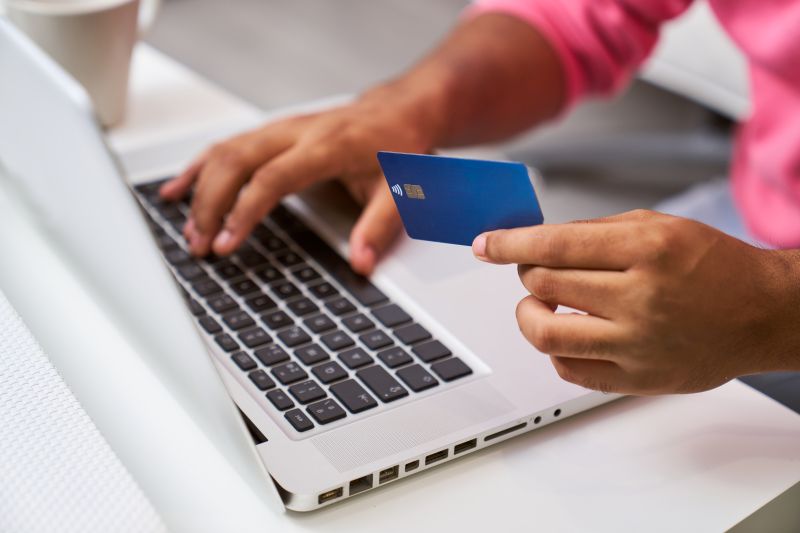 Unrecognizable man shopping online making payment online