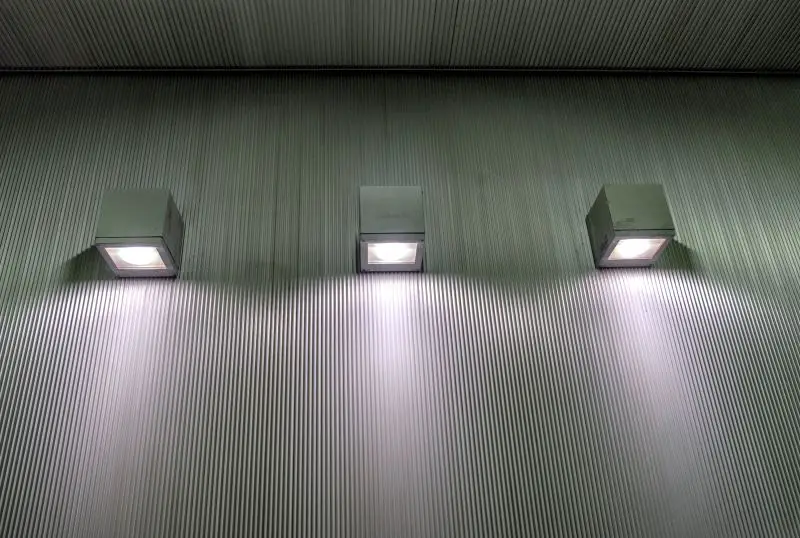 Three lamp light shine on gray container background