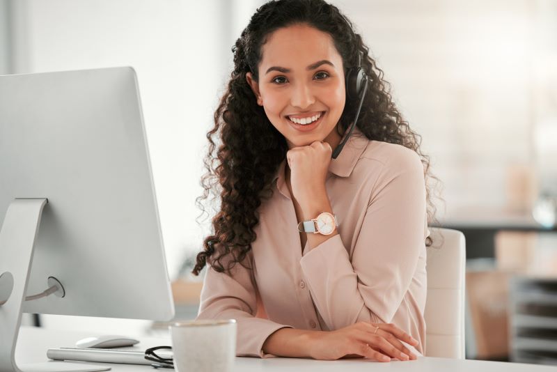 Keeping it professional. Shot of a young female virtual assistant in an office at work.