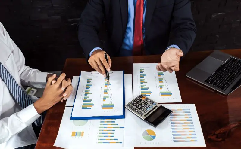 Two people in a business meeting to plan strategies to increase business income.