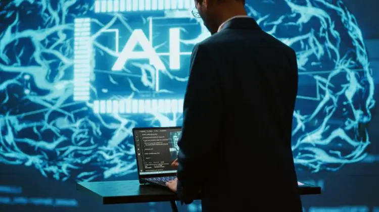 AI system administrator using laptop device in high tech futuristic workspace