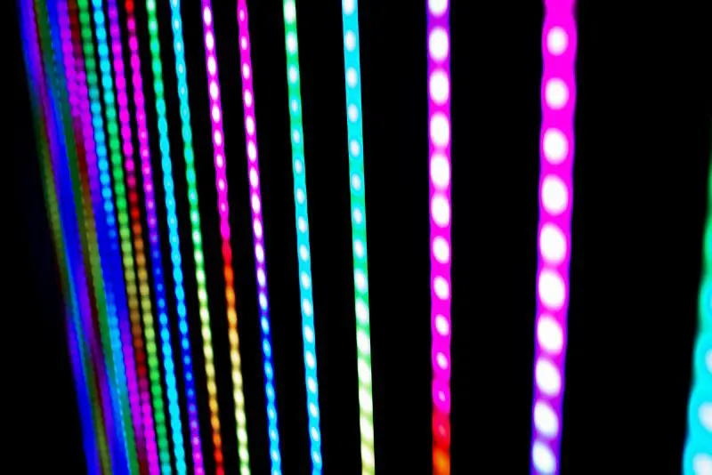 Detail of RGB LED strip lights lit in the dark.
