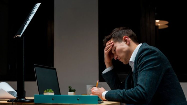 Adult male tired after working from home at night