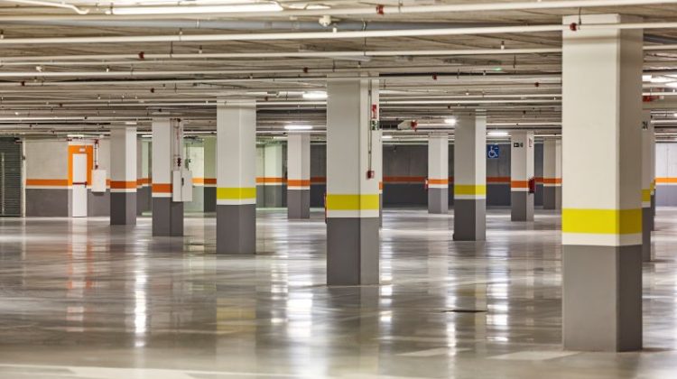 Underground vehicle parking lot. Brand new empty garage. Indoors