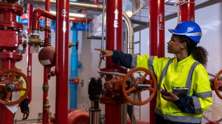 Engineer or technician work checking Fire suppression system and fire equipment.