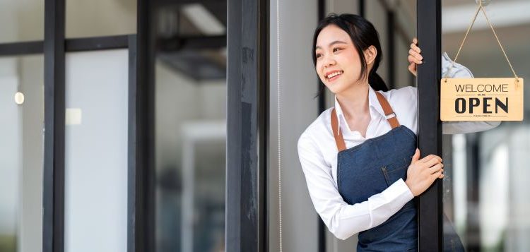 Portrait of an Asian woman barista cafe owner. SME entrepreneur seller business concept.