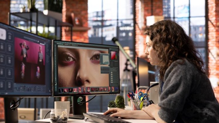 Woman using AI software to turn text prompt into photos and editing the skin