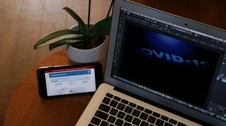 macbook air on brown wooden table