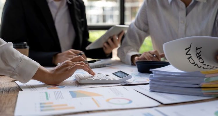 Business Team Analyzing Financial Reports in Modern Office