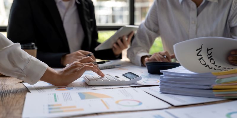 Business Team Analyzing Financial Reports in Modern Office